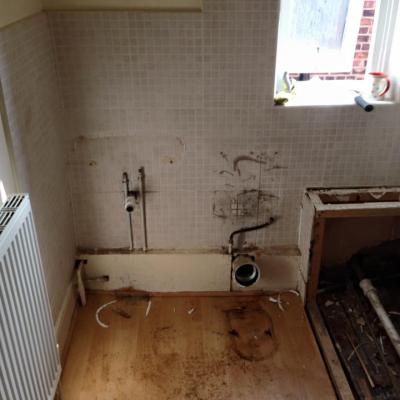 bathroom ripped out ready for new one being fitted